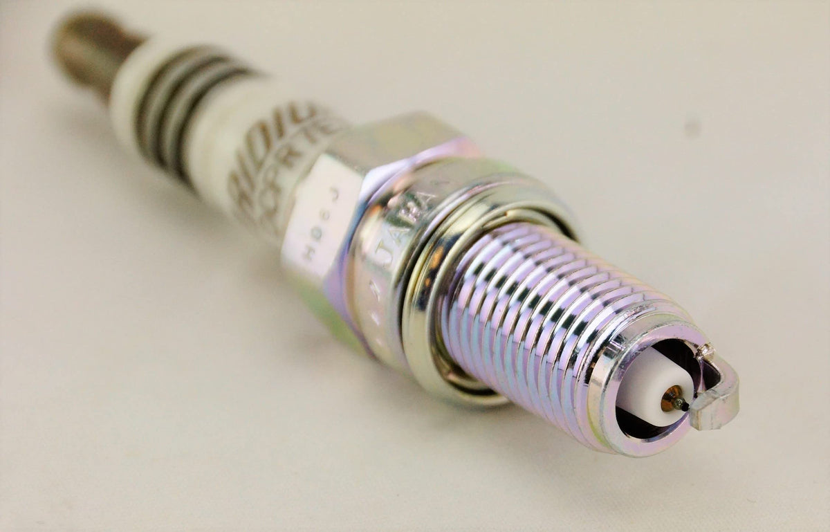 NGK iridium electrode close-up highlighting fine tip for consistent spark