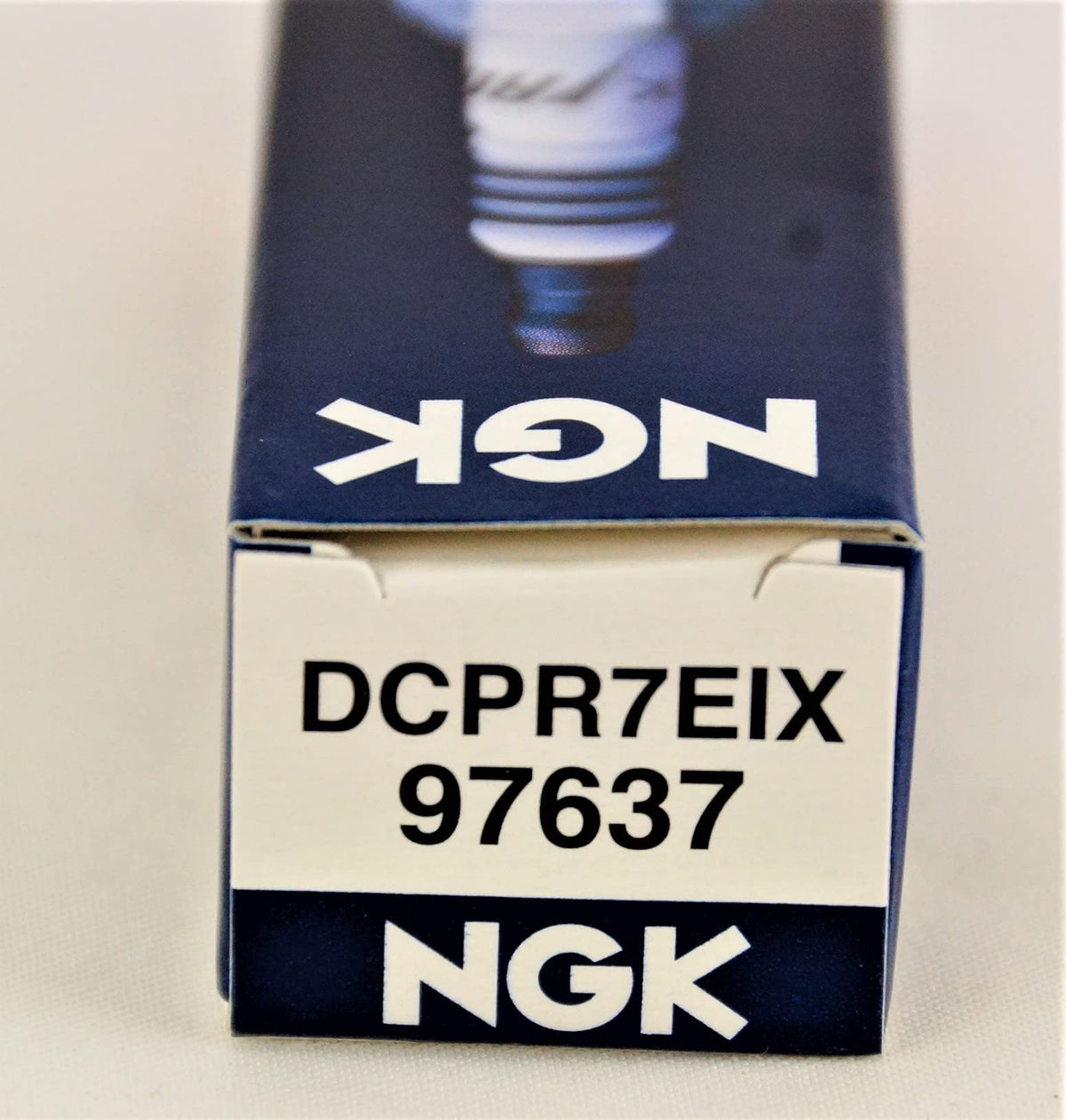 NGK spark plug installed in Harley engine illustrating proper fit and performance