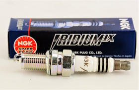 Four NGK 97637 spark plugs laid out demonstrating a complete replacement set