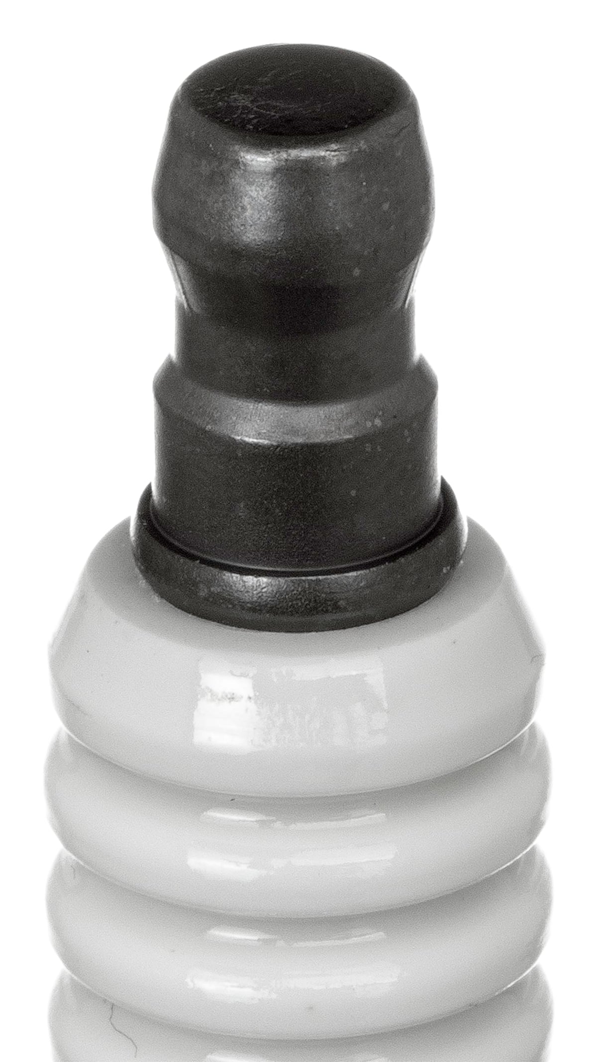 NGK BP8H-N-10 installed in engine and beside ruler showing correct size and fitment