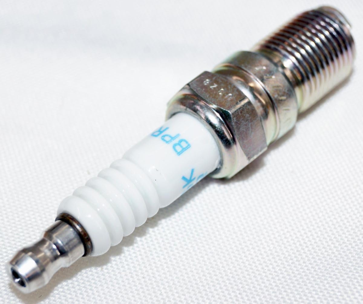 NGK plug installed in an engine spark plug well demonstrating proper fitment and benefit