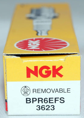 Garage workbench scene with NGK pack ready for vehicle tune-up for convenient maintenance