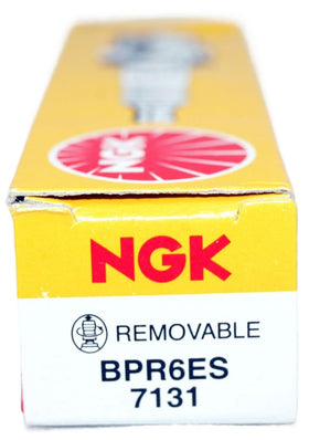 NGK BPR6ES 8-pack in a garage near tools — supports quick maintenance benefit