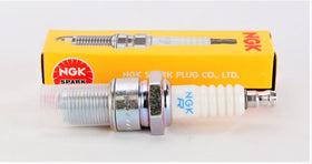 NGK BR8ES held in hand to show scale and ease of installation benefit