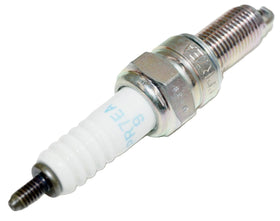 NGK ceramic insulator detail emphasizing alumina-silicate strength and improved dielectric performance
