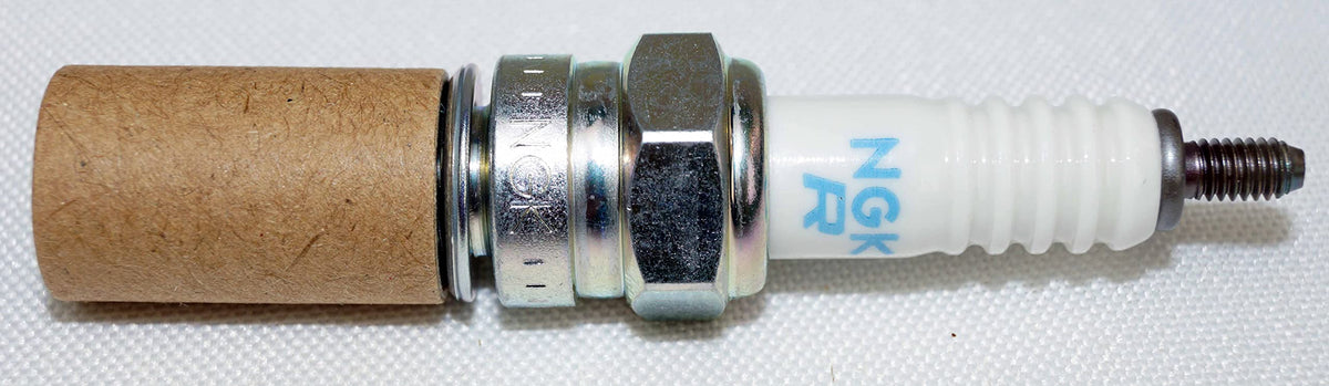 NGK CR7E angled side view showing porcelain insulator and threads for easy visual verification