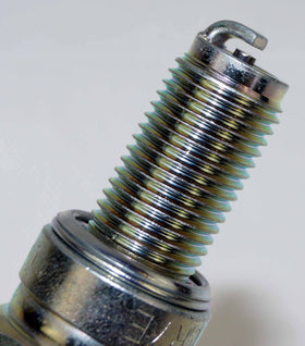 NGK CR7E next to ruler to show thread length and reach for correct fitment confirmation