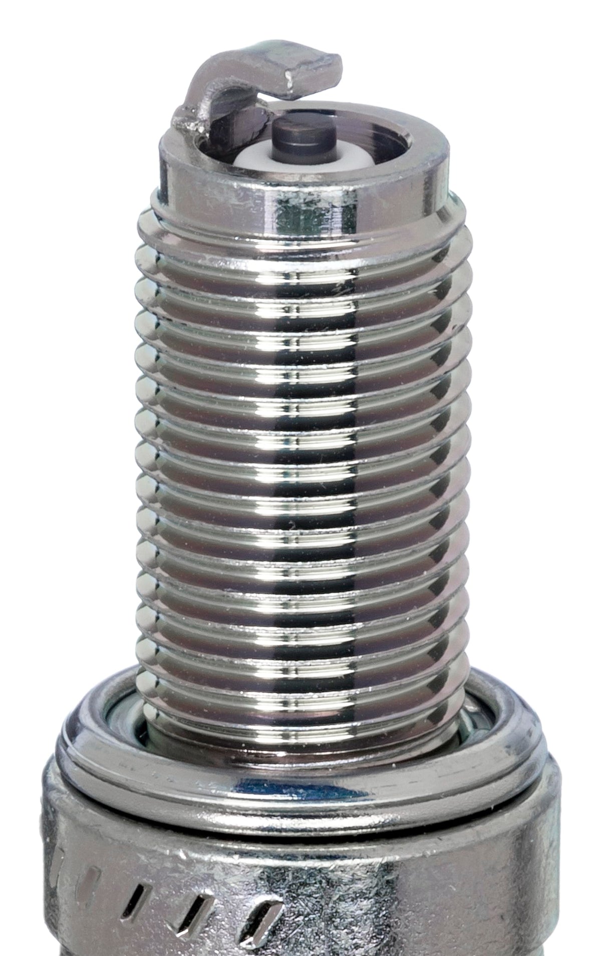 Close-up of NGK CR9EB electrode and ceramic insulator illustrating durable construction and reliable spark