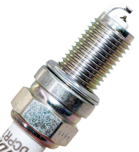 NGK spark plug gap measurement with feeler gauge ensuring optimal ignition
