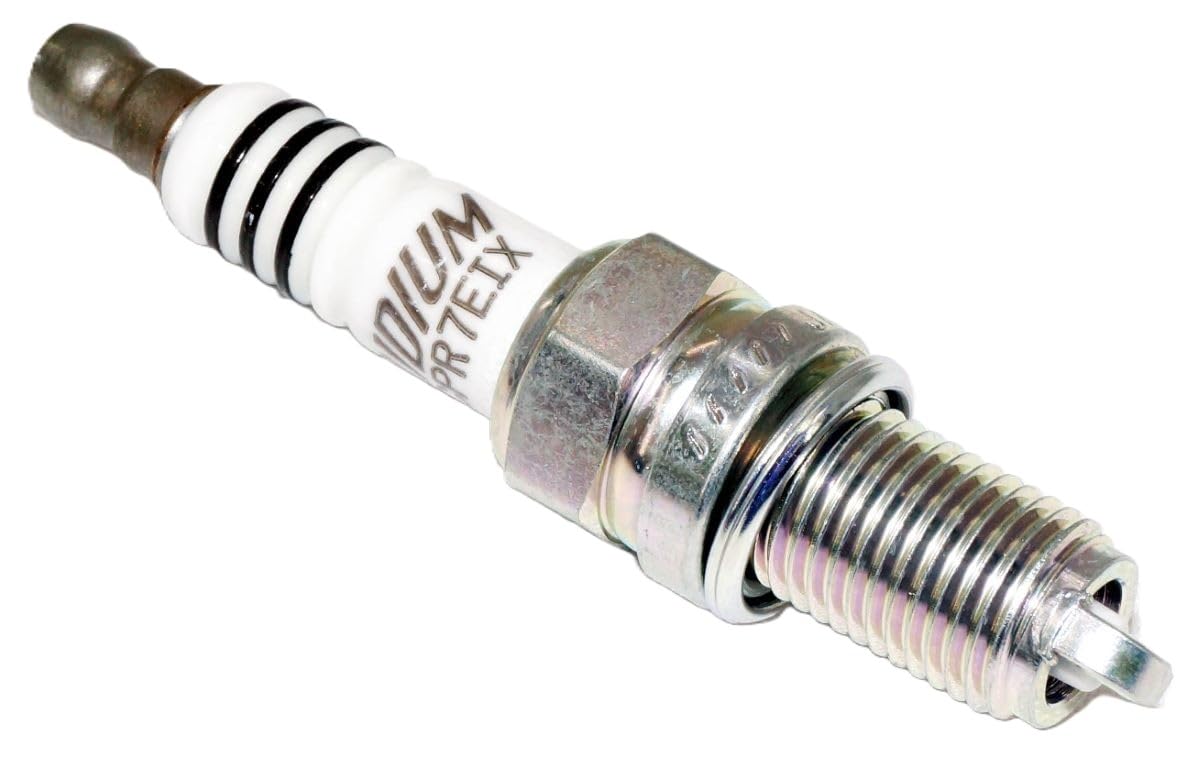 NGK spark plug next to ruler showing size and reach for fit verification