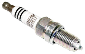 NGK spark plug next to ruler showing size and reach for fit verification