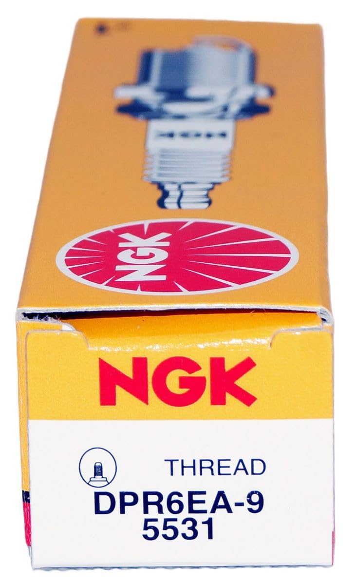 NGK DPR6EA-9 four-pack on a workbench conveying ready-to-install convenience