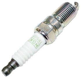 NGK plug beside ruler showing compact size and correct fitment