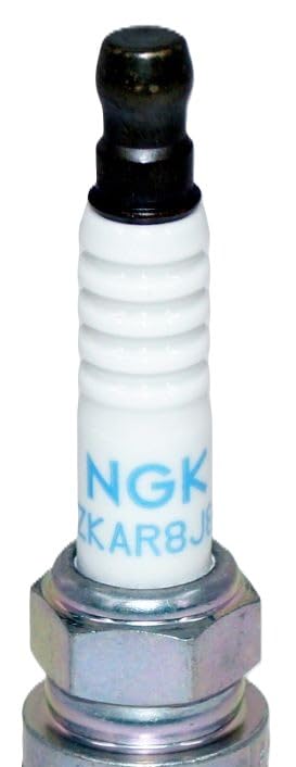 NGK spark plug held in hand showing size and scale advantage
