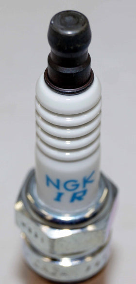 NGK plug seated in engine well demonstrating fit and installation benefit