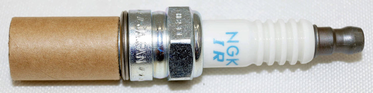 NGK four plugs arranged to show quantity and ready-for-install benefit