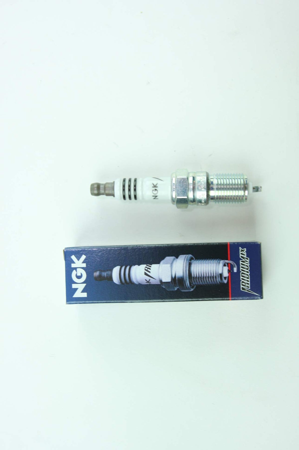 NGK spark plug installed in engine cylinder head demonstrating proper fitment and reliability