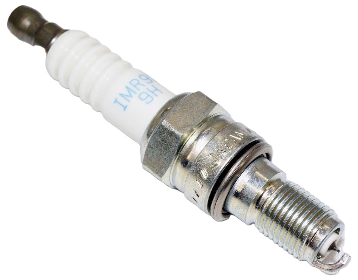 NGK spark plug installed in engine well demonstrating correct fit