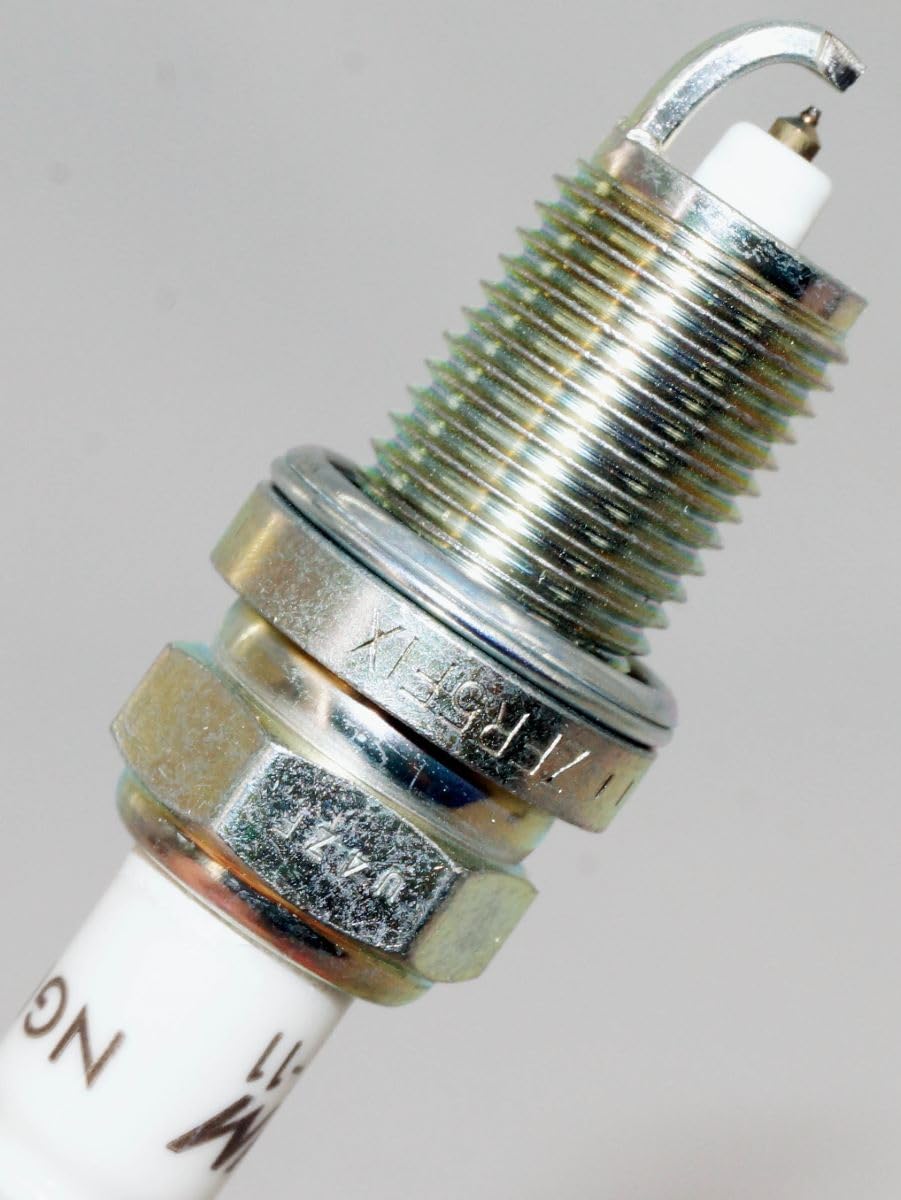 NGK spark plug installed in engine demonstrating proper application benefit