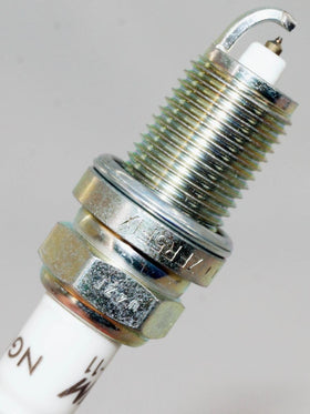 NGK spark plug installed in engine demonstrating proper application benefit