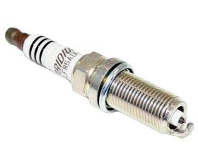 NGK spark plug installed in engine well demonstrating correct fit and reliable ignition