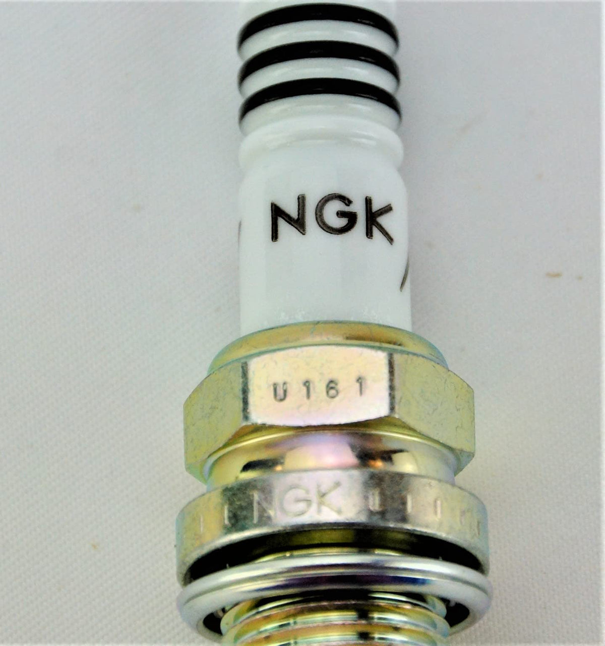 NGK insulator nose detail illustrating longer nose that reduces fouling