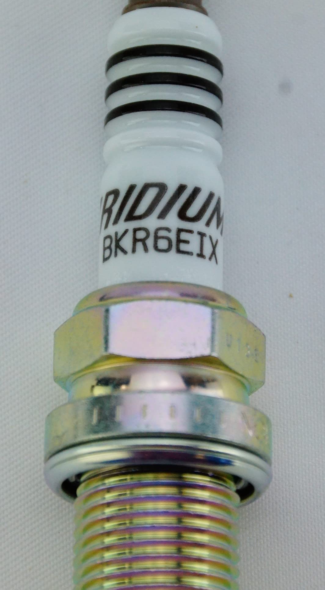 NGK iridium electrode close-up displaying fine tip for precise spark benefit