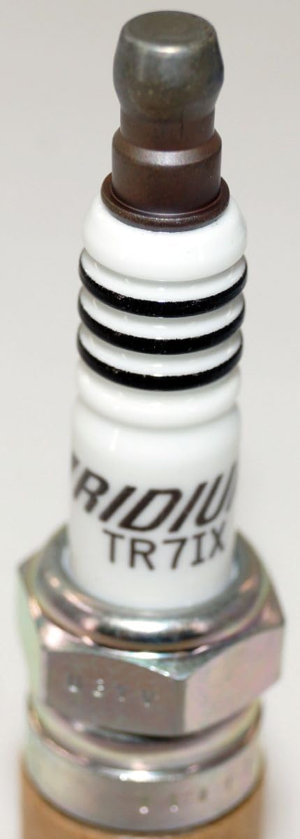 NGK Iridium IX in a garage setting indicating readiness for DIY or professional service