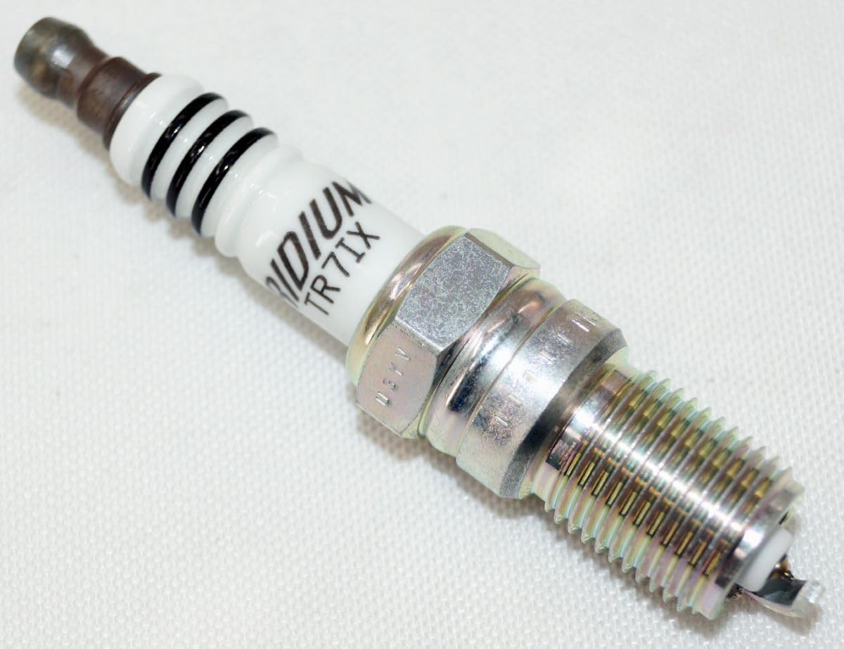 NGK plug beside a ruler illustrating compact size for simple fit and accurate replacement