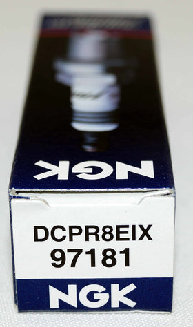 NGK iridium plug in garage lifestyle scene conveying dependable maintenance