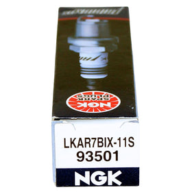 NGK spark plugs on workbench with tools conveying professional installation ease benefit