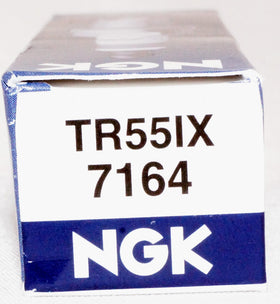 Mechanic replacing NGK plugs at roadside showing fast, reliable ignition service