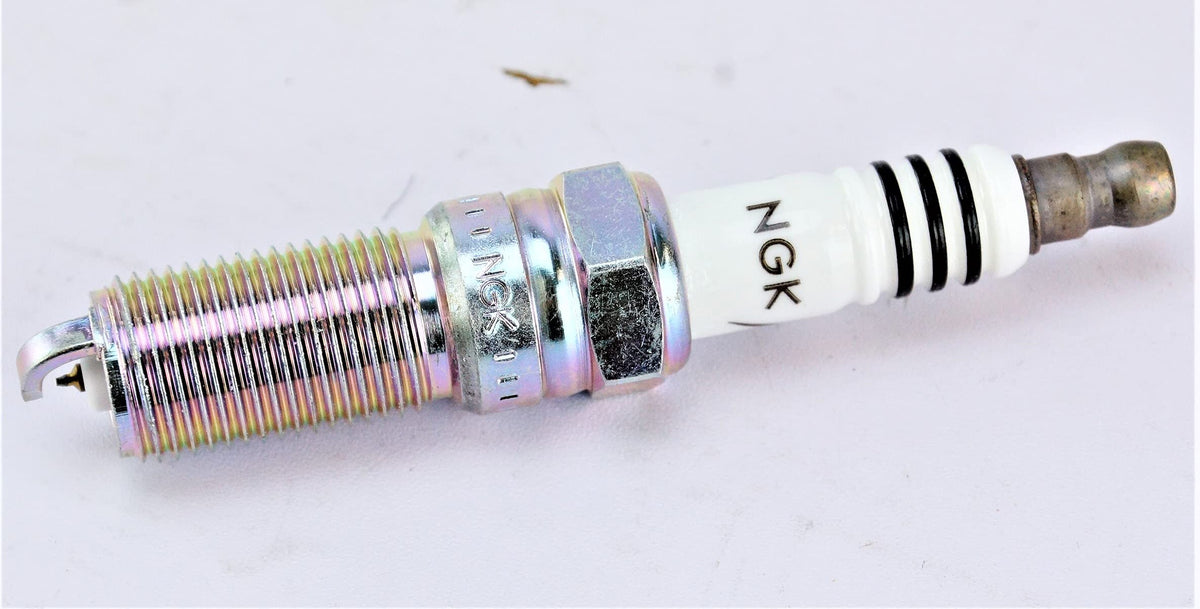NGK LTR5IX-11 next to ruler for scale, verifies reach and thread dimensions for fit