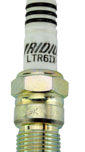 NGK LTR6IX-11 held in hand demonstrating size and ease of handling during service