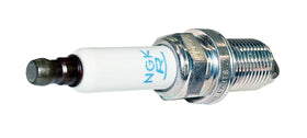 NGK spark plug installed in engine bay showing OEM compatibility benefit