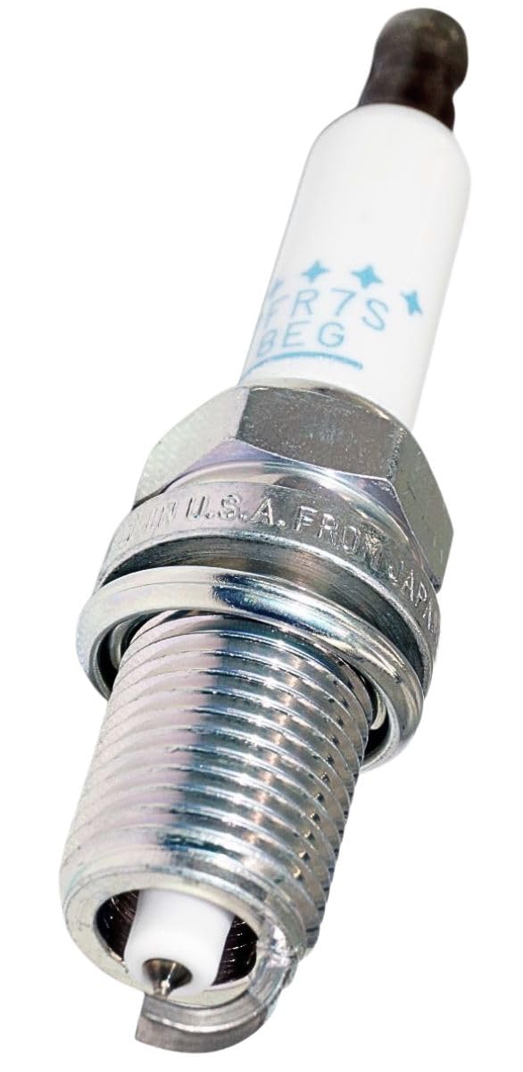 NGK spark plug held in hand demonstrating size and installation ease
