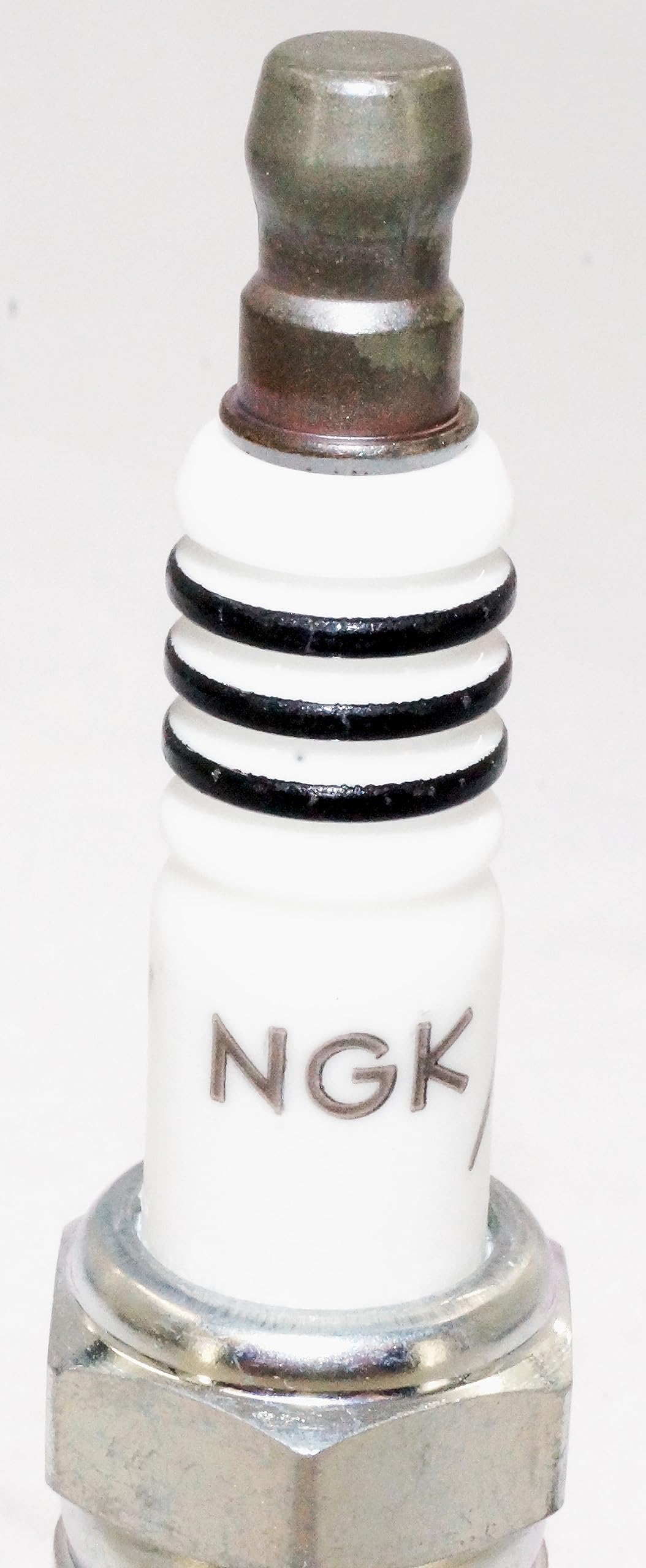 NGK plug gap detail with measurement illustrating proper setup and consistency