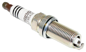 NGK plug gap measurement closeup assuring proper gap for stable combustion