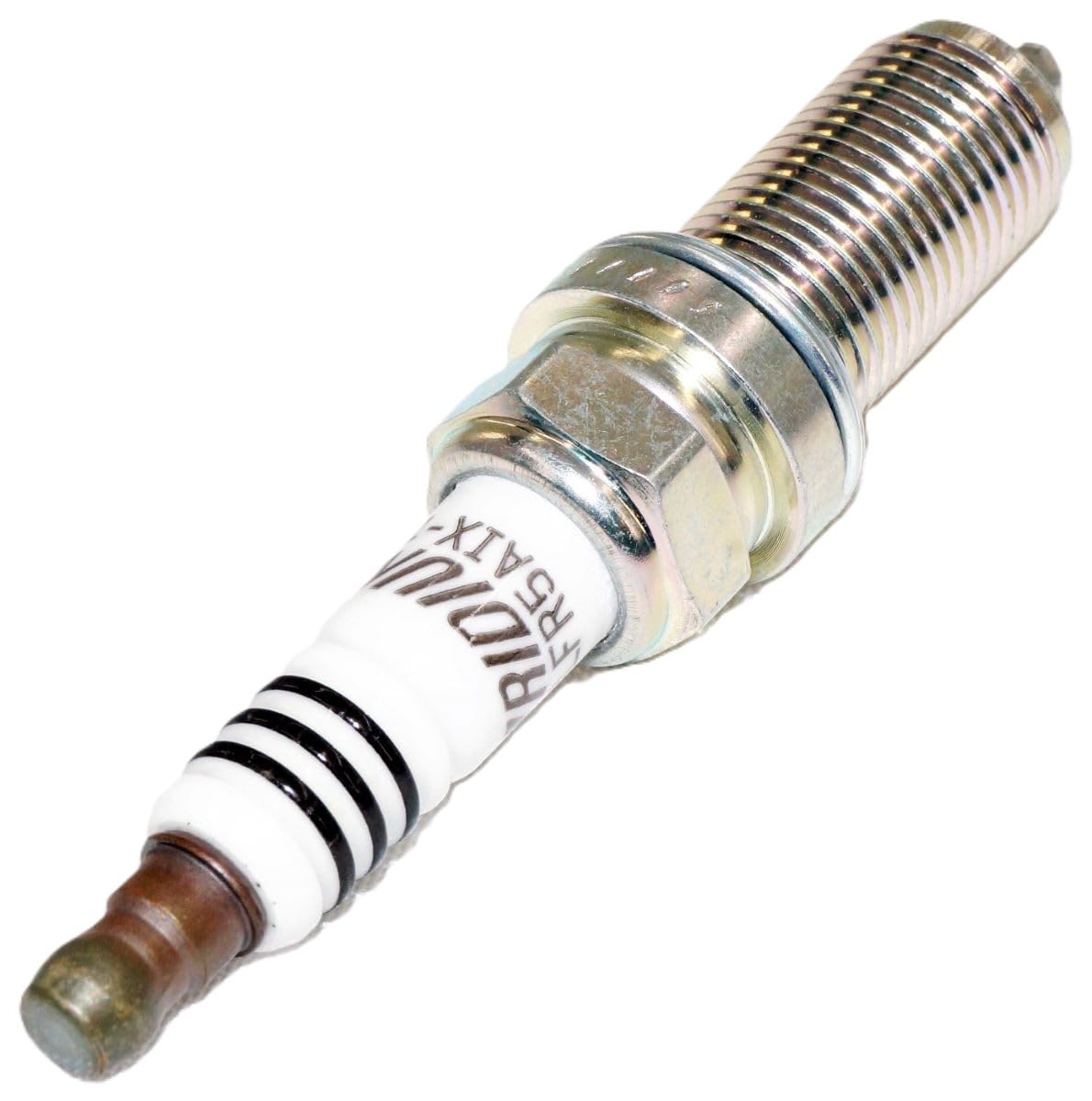 NGK spark plug held in palm for scale showing compact design and easy handling benefit
