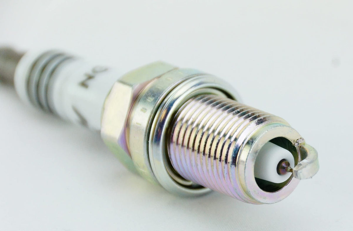 NGK spark plug installed in engine bay demonstrating fitment and proper function benefit