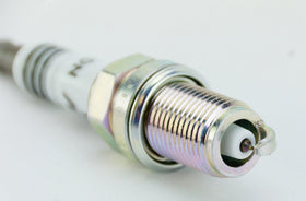 NGK spark plug installed in engine bay demonstrating fitment and proper function benefit