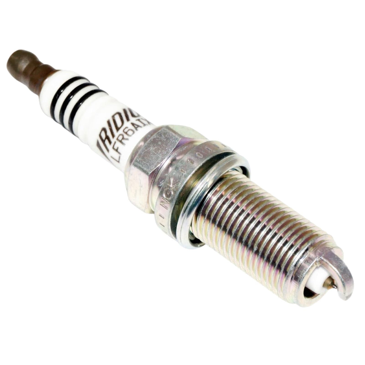 NGK spark plug next to a ruler for scale, showing compact size and OEM dimensions