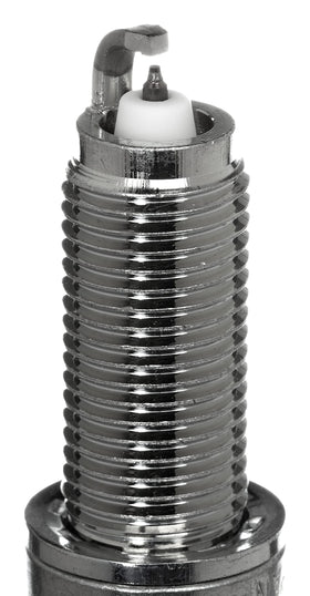 NGK spark plug seated in socket demonstrating correct installation fit
