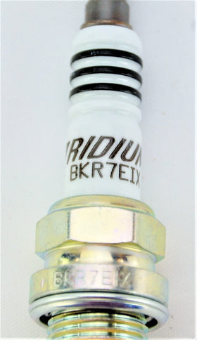 NGK spark plug side profile highlighting taper-cut ground electrode performance