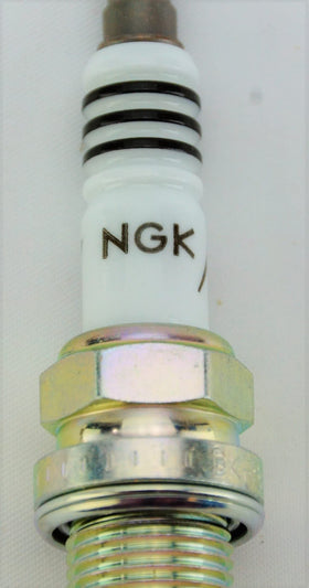 NGK spark plug side profile highlighting ceramic insulator for reliable sealing benefit