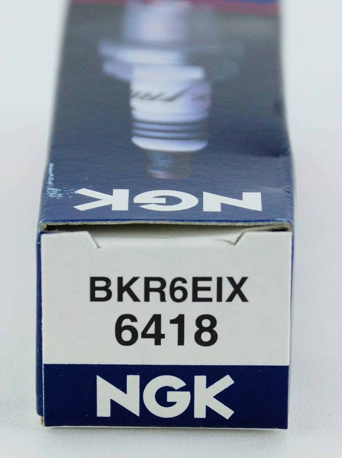 Macro of NGK electrode texture showing durable iridium surface for longer life benefit