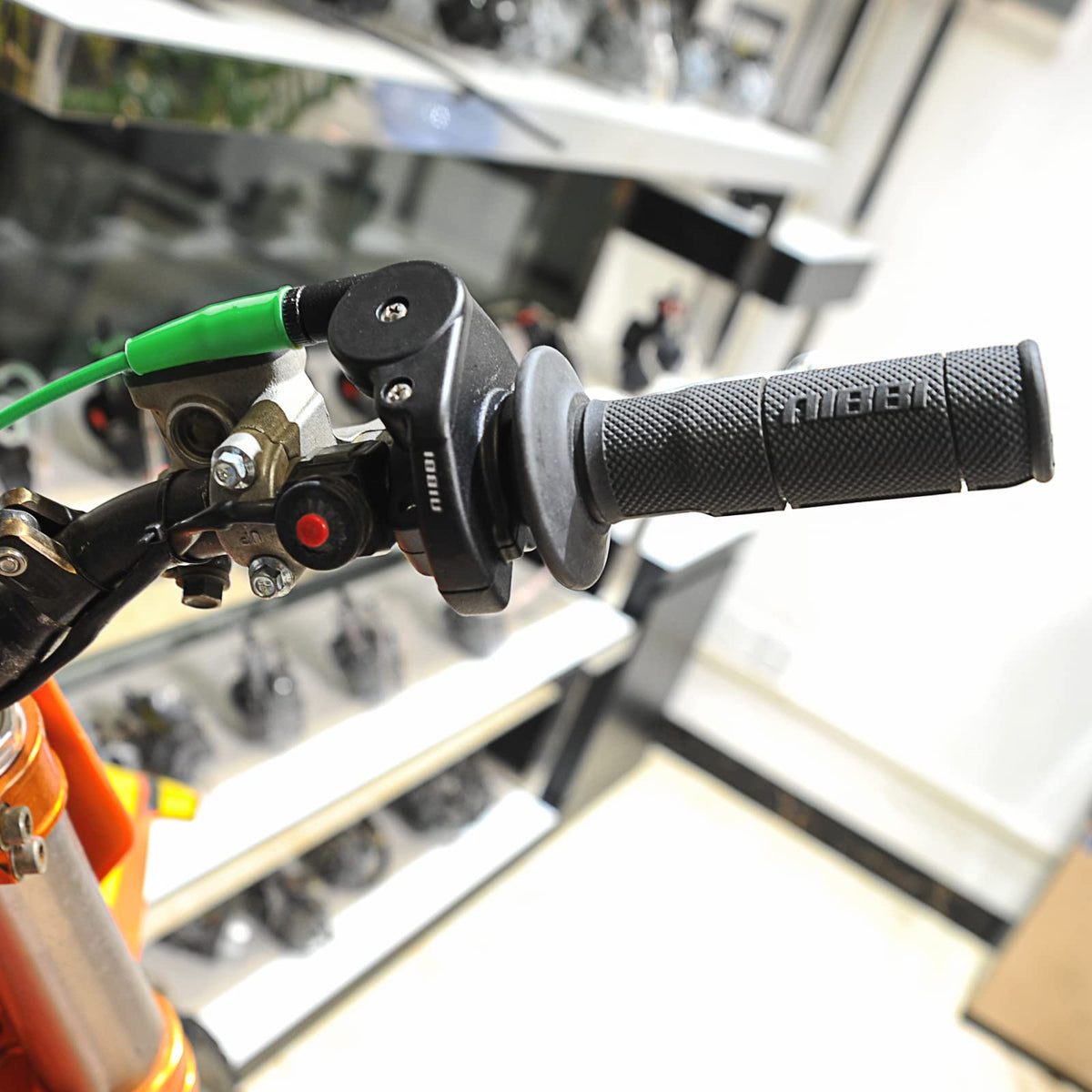 nibbi throttle assembly on a dirt bike in use showing improved handling