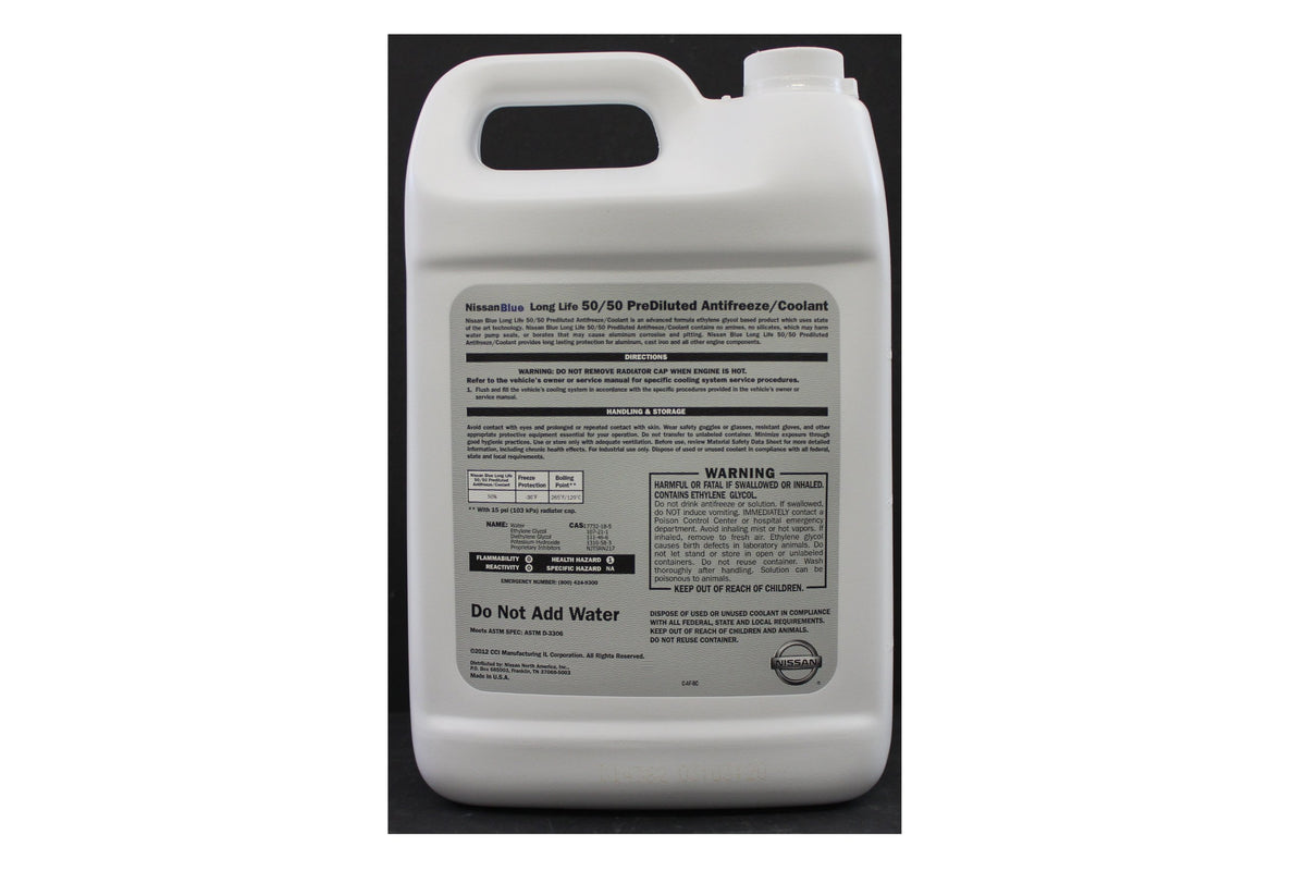 NISSAN antifreeze close-up of blue coolant and label, demonstrating factory-fill color and formulation
