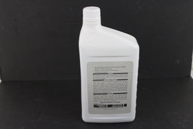Pouring NISSAN 999MP-CV0NS2 into transmission funnel demonstrating correct fluid use and protection