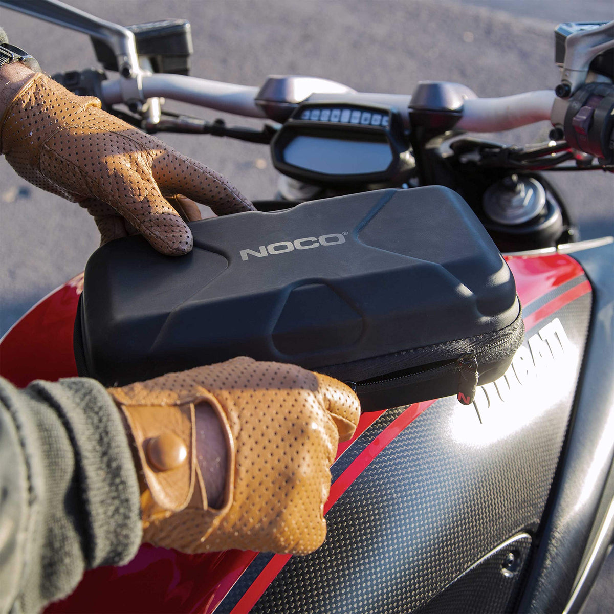 NOCO compact case in glovebox saving space and staying accessible
